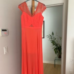 BCBG Maxazriafull length dress, soft pleated skirt in vibrant coral colour